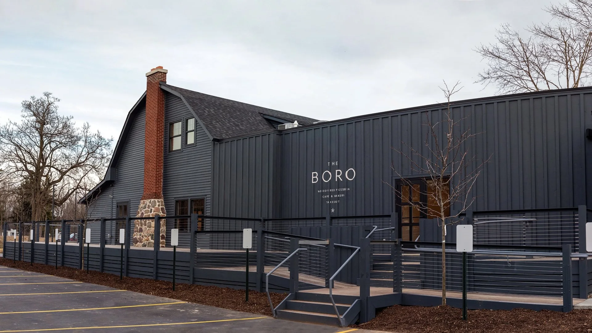 The dark barn exterior of The Boro at The Dixboro Project